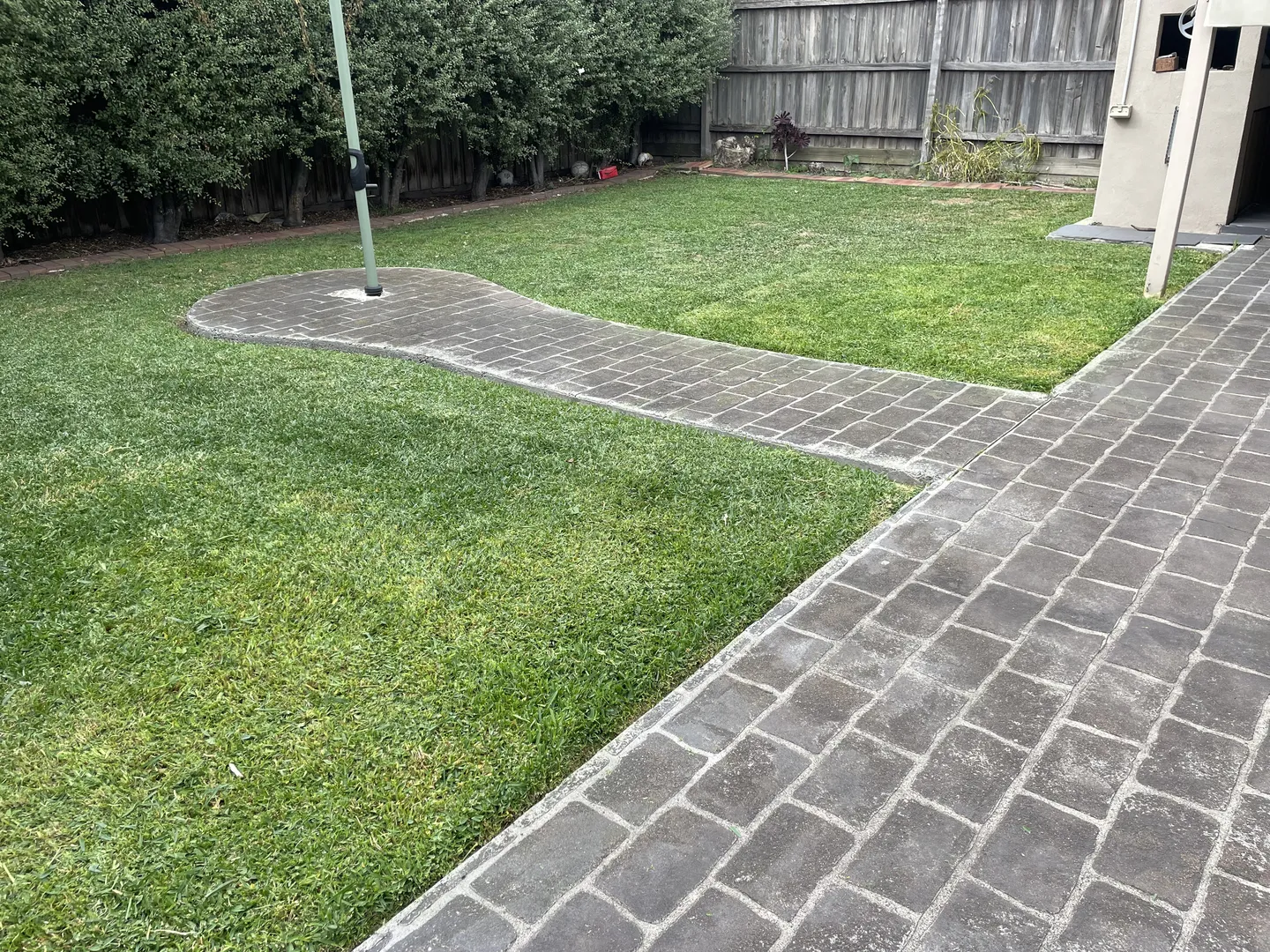 A freshly mown backyard lawn