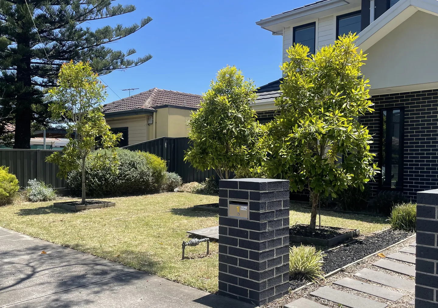Neat green lawn with small trimmed trees